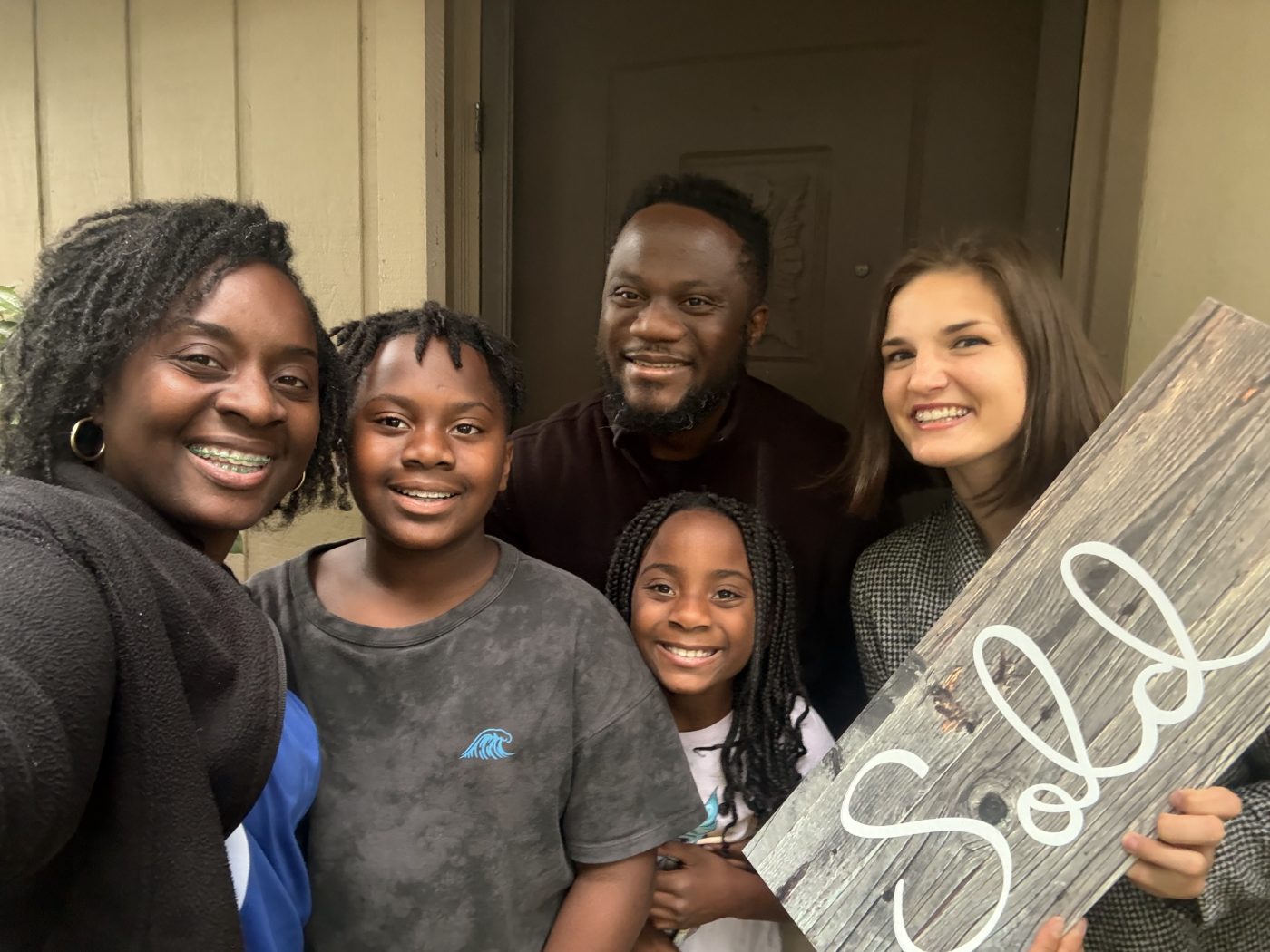 Mimi and Bill with their family at their first home